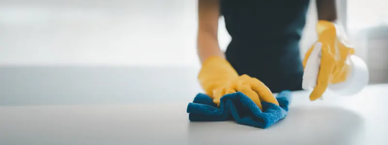 Wiping down a painted surface in an older Philadelphia home